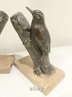 Bird-themed bookends signed M Leducq, Art Nouveau wildlife in bronze.