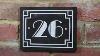 Screw Fixing An Art Deco Engraved Granite House Number Sign