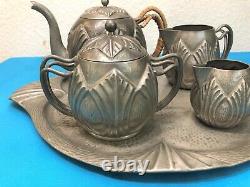 Translation: Old ART DECO tea and coffee service in pewter, signed Alice and Eugène CHANAL, with tray.